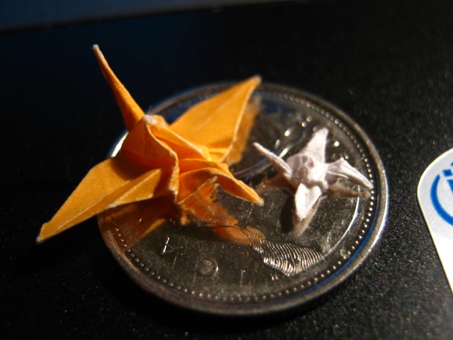 Two Origami Cranes on a Quarter